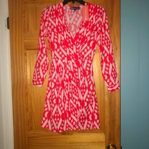 Long sleeve red cocktail dress.
